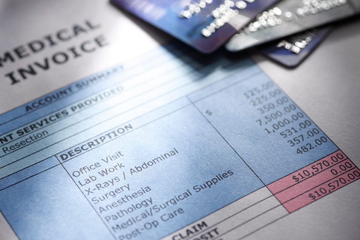 Medical bill with credit cards sitting on top