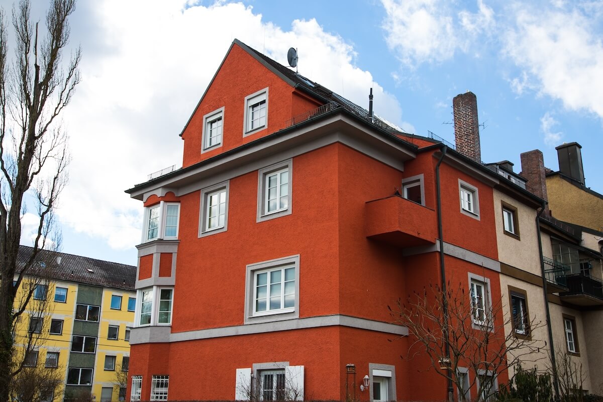 Red multifamily house under renovation