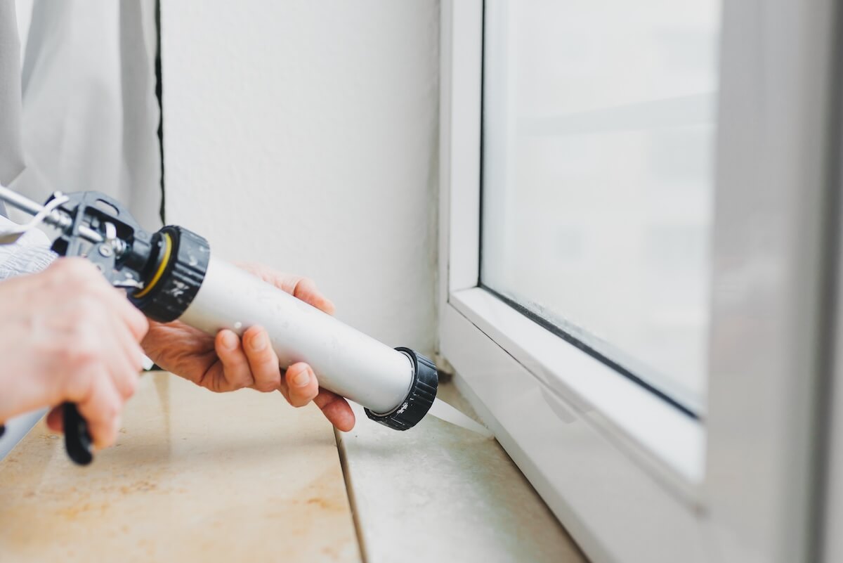 Applying sealant to window frame